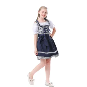 Detailed view of Bavarian dirndl dress with traditional floral print, white blouse and lace trim.