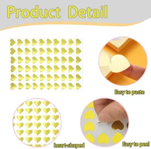 Close up detail of shiny golden heart stickers, easy peel adhesive for crafts and envelope seals.