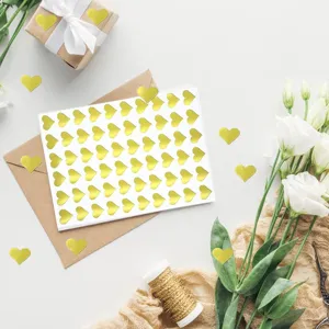 Gold heart stickers self-adhesive metallic foil labels for envelope sealing DIY crafts.
