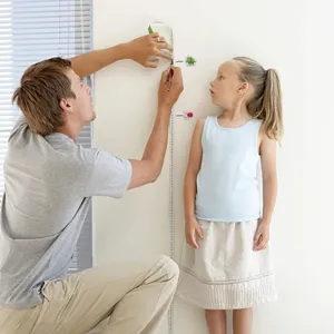 Kids height growth chart wall sticker with cute cartoon animal designs for room decor.