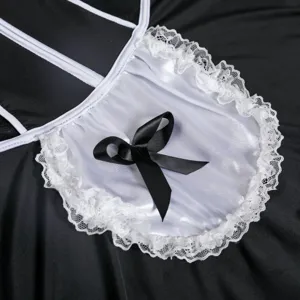 Close-up detail of maid costume white lace apron and black bow, premium fabric texture.
