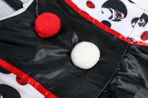 Detailed view of Halloween vampire clown costume featuring black satin and plush pom-poms.