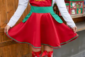 Detailed view of Christmas cosplay costume, featuring red skirt with green waist and trim.