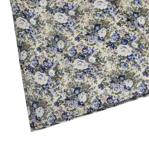 Fabric detail close-up showing vintage blue floral pattern and neat hem stitching.
