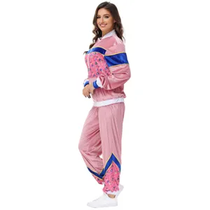 Retro 70s velour tracksuit jacket and pants set, pink retro printed party costume.