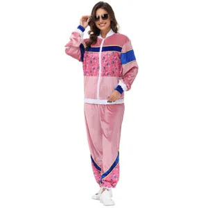 Retro 70s velour tracksuit detail view, pink velvet jacket and pants for party and festival.
