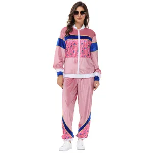 Detailed view of the 70s retro pink velvet tracksuit, showing color block design and texture.