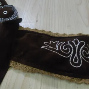 German Oktoberfest costume detail embroidered belt accessory dark brown fabric view