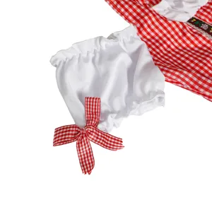 Close-up detail of Oktoberfest dirndl sleeve with red and white checkered bow and fabric.