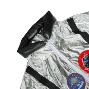 Close-up detail of silver astronaut costume jacket, metallic fabric, stylish collar and patch.