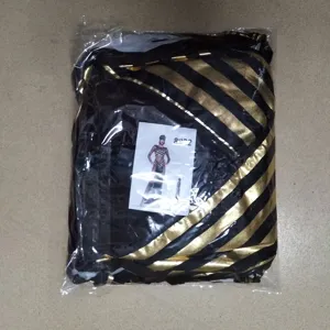 Detailed shot of the packaged black and gold Halloween Greek goddess costume for party use.