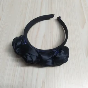 Black fabric rose headband detail view, gothic hair accessory for costumes and parties.