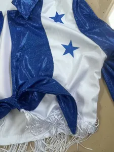 Detail view of women sexy blue sparkly star cheerleader costume top with front tie and fringe.