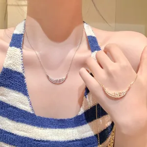 Pavé crystal crescent moon pendant necklace set, elegant silver and gold clavicle chain.