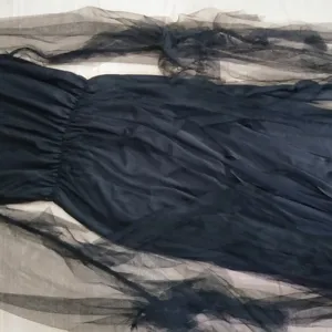 Black Halloween ghost bride costume detail, sheer tulle long sleeves and gathered waist design.