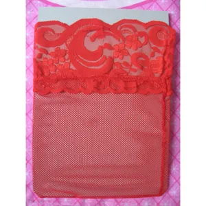 Close-up detail of red lace top and fishnet mesh fabric on hosiery packaging card.