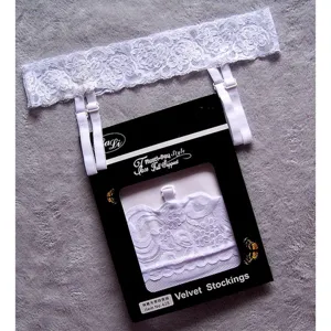 White lace garter belt set detail view, featuring adjustable elastic straps and elegant packaging box.