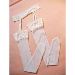 Detail view of the white lace garter belt and sheer thigh high stockings set for women.