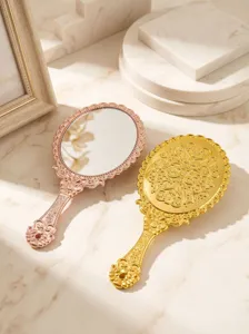 Vintage European handheld makeup mirror with baroque embossed handle for elegant daily use.