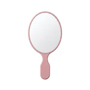 Specchio da trucco ovale minimalista in rosa pastel, ideale per i ritocchi quotidiani e regali.