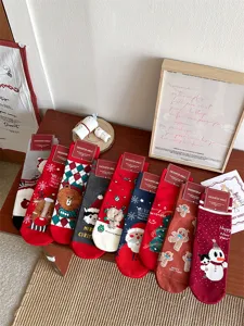 Cute Christmas cotton socks for women, featuring festive Santa, snowman and cartoon bear designs.