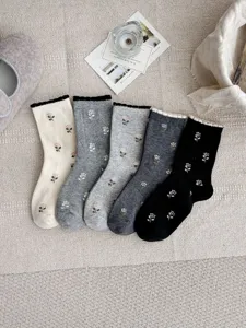 Close-up detail of women's floral mid-tube socks with cute ruffle bubble cuffs and soft fabric.