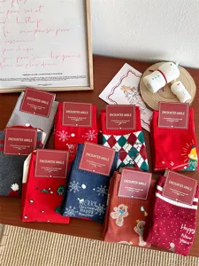 Christmas cotton mid-tube socks for women with cute cartoon elk, Santa and snowflake patterns.