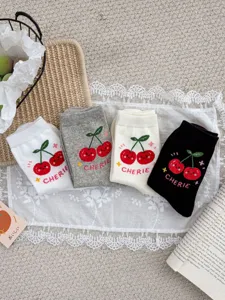 Cute cherry pattern mid-tube socks detail view, soft combed cotton casual daily wear for women.