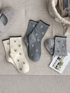 Chic floral knit mid-tube socks with cute ruffle bubble cuff and comfortable combed cotton fabric.