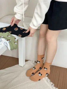 Detail view of cute animal pattern mid-tube cotton socks in multiple colors for daily wear.