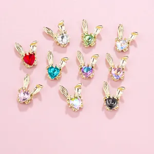 Detailed view of rabbit ear rhinestone nail art charms, alloy heart crystal DIY manicure decor.