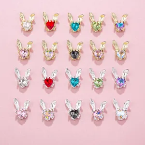 Metal bunny nail art charms with heart crystals, diy manicure decorations in various colors.