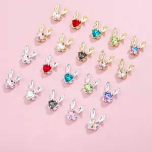 Detailed shot of cute rabbit nail art charms with colorful crystal rhinestones and shiny alloy base.