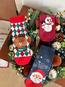 Christmas cotton socks detail featuring cute holiday cartoon patterns like Santa and snowman.