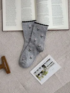 Gray cotton mid-calf socks featuring charming pink floral patterns and cozy frilly cuffs daily wear.