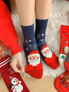 Detail view of Christmas cotton socks featuring cute Santa Claus and snowman patterns for women.