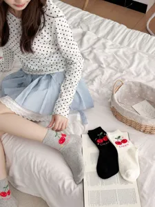 Cute cotton mid-tube socks featuring sweet cherry embroidery and comfortable daily wear style.