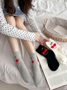 Detailed view of cute cotton mid-tube socks with sweet cherry embroidery for daily wear.