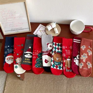 Christmas cotton mid-calf socks for women featuring cute Santa and cartoon deer patterns.