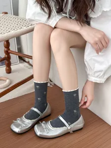Floral combed cotton mid-tube socks with cute bubble cuffs for women daily wear details.