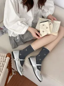 Floral embroidered mid tube cotton socks detail shot, cute bubble cuff design for women.