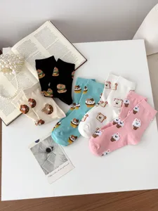 Cute cotton mid-tube socks for women, featuring fun cartoon bear and donut fuzzy designs.
