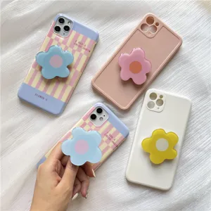 Aesthetic floral phone case with collapsible 3D flower grip, pastel check design.