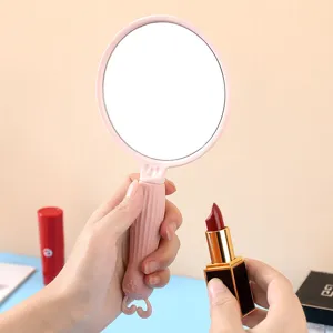Niedlicher Make-up-Handspiegel im Ins-Stil mit rosa Hasen-Griff für den täglichen Gebrauch.