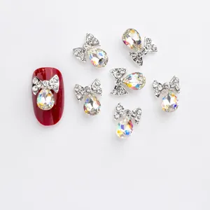 Exquisite alloy bow nail art rhinestones with K9 crystal AB glass for sparkling manicures.