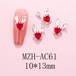 Silver-tone rabbit ear heart rhinestone nail charms, sparkling DIY manicure art decor.