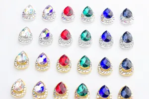 Detailed view of teardrop nail art rhinestones with colorful crystals and alloy bases for gorgeous decoration.