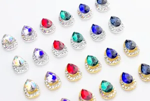 Teardrop rhinestone nail charms detail showing colorful crystal and alloy base design closely.