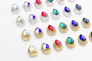 Detailed view of teardrop nail rhinestones, AB color and alloy flatback design.