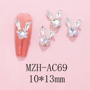 Detailed shot of cute bunny ear rhinestone nail art charms, alloy design, size 10x13mm.